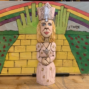 A Hand carved Folk Art style Glinda the Good Witch from the 1939 film, &quot;The Wizard of Oz&quot;.