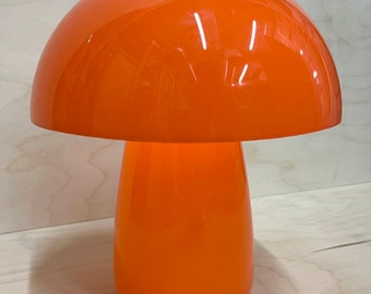 Mushroom minimalistic lamp in orange with touch light.