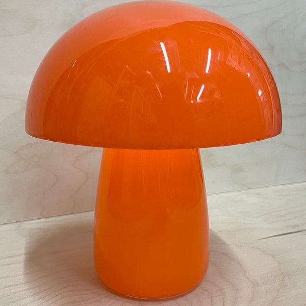 Mushroom minimalistic lamp in orange with touch light.