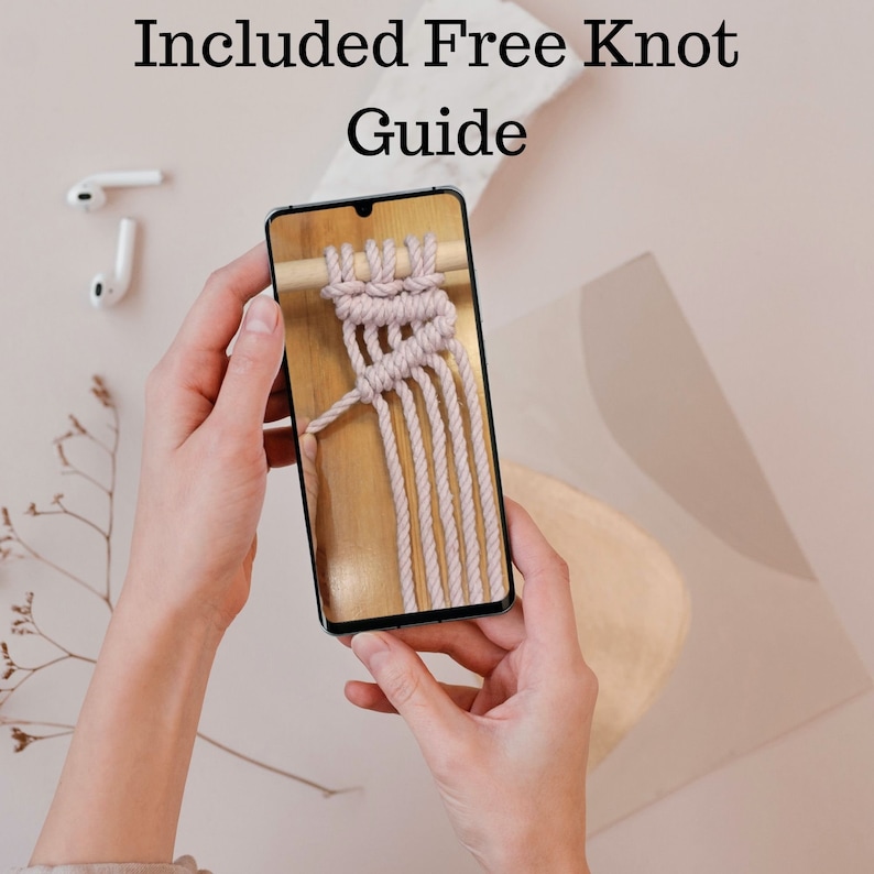 May include: A close-up of a smartphone screen displaying a knot tying tutorial. The tutorial shows a step-by-step guide on how to tie a knot using a light pink rope. The text "Included Free Knot Guide" is visible at the top of the image.