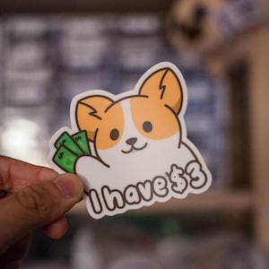 Pegatina de meme de Corgi con tres dólares - Vinilo mate, resistente a la intemperie y a los arañazos, troquelada para coche, portátil y botella de agua.
