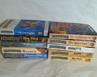 May include: A stack of Forgotten Realms fantasy adventure books. Titles include "The Coral Kingdom", "King Pinch", "The Halfling's Gem", "Horselords", "Streams of Silver", "The Giant Among Us", "The Ogre's Pact", "Ironhelm", "Candlekeep", and "Night Masks".