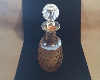 Vintage glass decanter with cork and glass stopper
