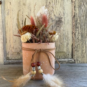Terracotta vessel with leather strap, pearl feathers in vintage, boho look