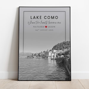 May include: Black and white framed print of Lake Como with text. The text reads "Lake Como Where two hearts became one" with names Natasha and Jason, and the date January 24th, 2015. The image shows a scenic view of the lake and surrounding buildings.