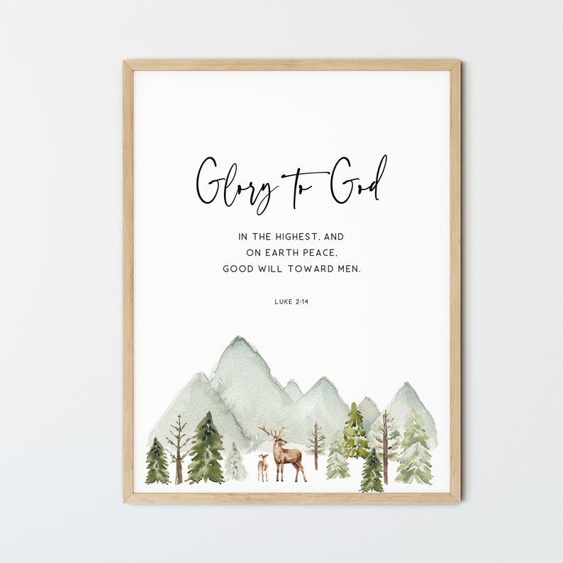 May include: A watercolor print with a mountain scene and a deer family. The print features the text "Glory to God" and the Bible verse "Luke 2:14".