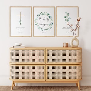 May include: Three framed prints with inspirational quotes and greenery designs. The prints feature the text "Before you were born I set you apart", "Be strong and courageous", and "And the child grew and became strong".