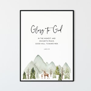 May include: A watercolor print with a mountain landscape, two deer, and the text "Glory to God" in cursive. The text below reads "In the highest, and on earth peace. Good will toward men. Luke 2:14".