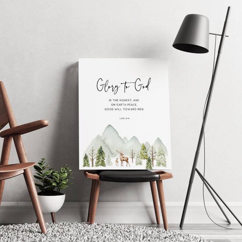 May include: A watercolor print with a mountain scene and a deer and fawn. The print has the text "Glory to God" and a Bible verse from Luke 2:14.