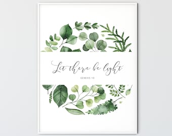 Puede incluir: Una impresión enmarcada en blanco con una ilustración de acuarela de hojas verdes dispuestas en círculo. El texto "Que haya luz" está escrito en cursiva negra con las palabras "Génesis 13" debajo.