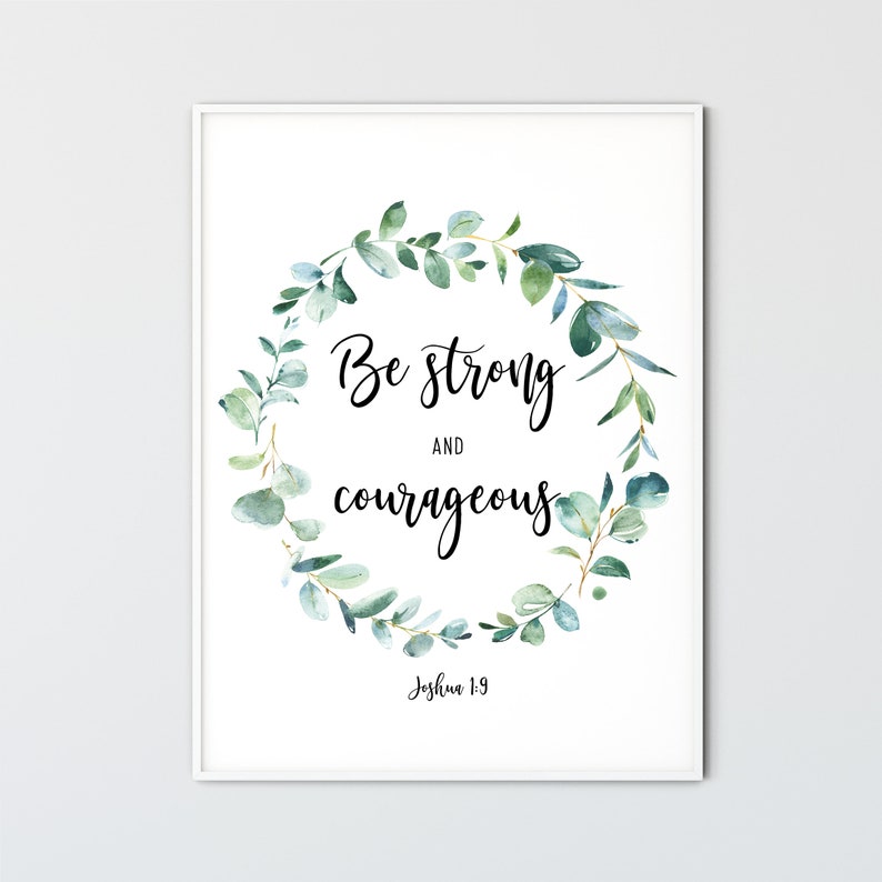 May include: A white framed print with a green watercolor wreath and the text "Be strong and courageous Joshua 1:9".