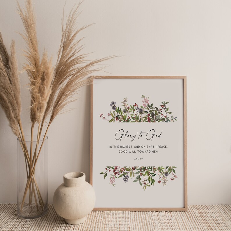 May include: A printable wall art design featuring a floral border with a white background. The text reads "Glory to God in the highest, and on earth peace. Good will toward men. Luke 2:14"
