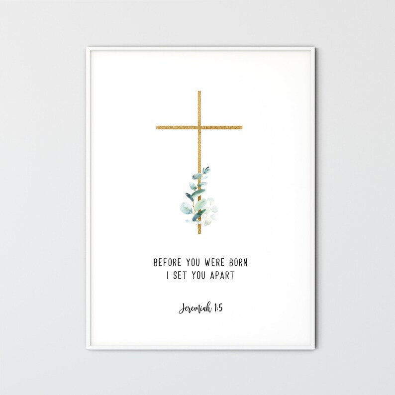 May include: A white printable art print with a gold cross and green leaves. The text reads "Before you were born I set you apart Jeremiah 1:5"