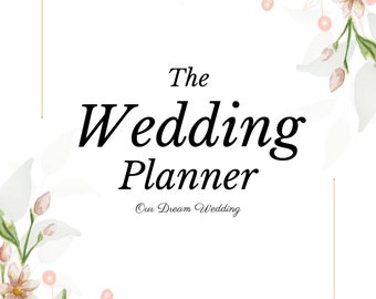 May include: A white background with a gold frame and floral accents. The text "The Wedding Planner" is centred on the page with the text "Our Dream Wedding" below it.