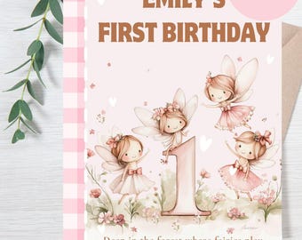 May include: A pink birthday card with the text "Emily's First Birthday" and "A Fairy-Tale Birthday." The card features illustrations of fairies and the number 1. The words "Storybook Theme Birthday" are also present.