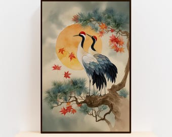 May include: A framed watercolor print featuring two cranes perched on a tree branch. The artwork showcases a full moon, red maple leaves, and a pine tree, with a soft, cloudy background. The cranes have red crowns, white necks, and blue-grey wings.