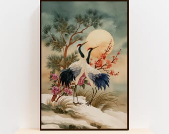 May include: Framed art print featuring two cranes with red crests and black and blue wings, standing on a snowy landscape. The background includes a full moon, flowering branches, and a pine tree, all under a cloudy sky.