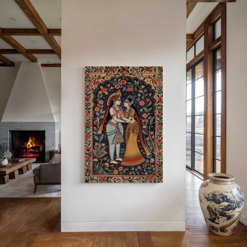 Vertical Krishna and Radha canvas wall art displayed on a white wall in a contemporary living room