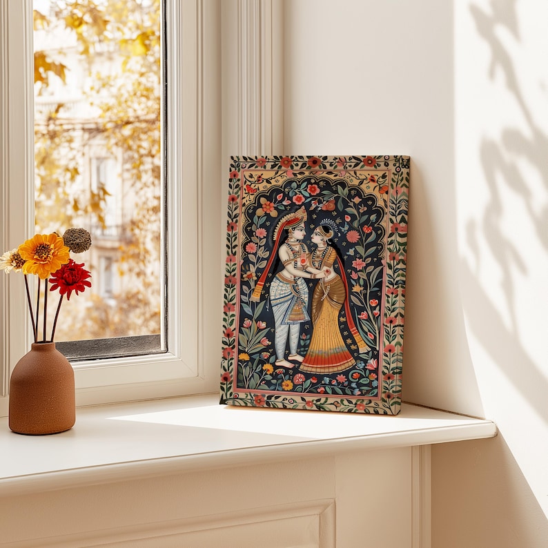 Radha Krishna canvas art displayed beside a sunny window with colorful Indian floral folk art details
