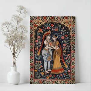 Indian god wall art featuring Radha and Krishna with ornate flowers displayed in a bright minimalist room