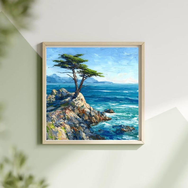 May include: Oil painting of a coastal landscape featuring a lone tree atop a rocky outcrop. The artwork depicts a vibrant blue ocean under a clear sky, framed in a light wood. The tree's green foliage contrasts with the blue and gray tones.