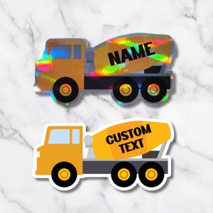 May include: Two stickers of cement mixer trucks. One is yellow with a holographic mixer drum and the word "NAME" in black. The other is yellow with the words "CUSTOM TEXT" in black on the mixer drum.