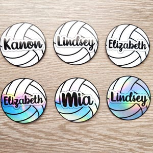 May include: Six volleyball-themed stickers with names written in black on a white background. The names are Kanon, Lindsey, Elizabeth, Mia, and Lindsey.