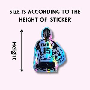 May include: Holographic sticker of a soccer player with the name "EMILY" and the number "15" on the jersey, holding a soccer ball. The sticker's size is determined by its height, as indicated by the text and arrow.