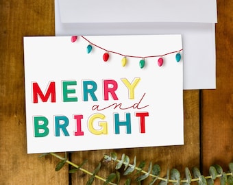 Tarjeta de felicitación feliz y brillante / Tarjeta de luces navideñas coloridas / Tarjeta de Navidad