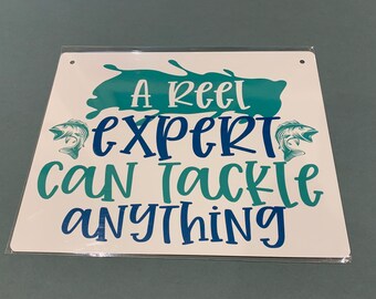 Letrero con temática de pesca. Un experto en carretes puede hacer frente a cualquier cosa. Letrero de aluminio resistente a la intemperie.