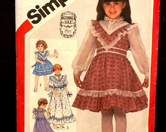 Simplicity 5773 carefully cut and complete Iconic Gunne Sax girls dress pattern with three different views.