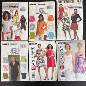 May include: Six Butterick sewing pattern envelopes arranged in two rows. The patterns are labeled B4685, B4684, 5891, B4469, B5305, and B4769. Each envelope displays illustrations of various tops, dresses, and skirts with different colors and patterns.