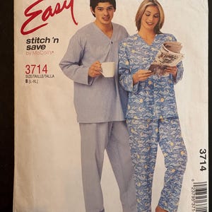 May include: A McCall's Easy stitch 'n save sewing pattern envelope 3714, size B (L-XL), featuring illustrations of two sets of pajamas: one solid light blue and one blue with a moon and cloud print, with text including Easy and 3714.