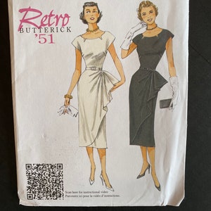 May include: A vintage sewing pattern for a dress, featuring two women wearing different styles of dresses. The pattern is from Butterick, a well-known sewing pattern company, and is labelled "Retro '51".