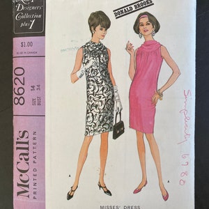 May include: Vintage McCall's printed pattern for Misses' dresses. The cover features illustrations of two women in stylish dresses. One dress is black and white, the other is pink. The pattern includes the text "New York Designers Collection plus 1".