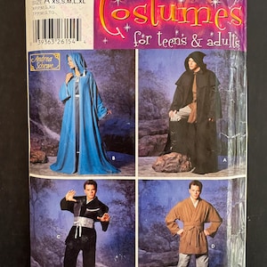 May include: A Simplicity sewing pattern envelope 0606 for costumes for teens and adults. The cover displays four costume variations: a blue hooded robe, a black hooded cloak, a black martial arts style outfit with a sash, and a tan wrap tunic.