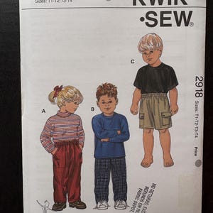 May include: A Kwik Sew pattern envelope featuring illustrations of three children in different outfits. The pattern number is 2918, with sizes T1-T2-T3-T4. The envelope includes the text "KWIK SEW" and the designer's name, Kerstin Martensson.