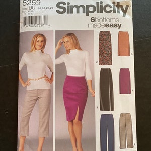 Peut inclure: Patron de couture Simplicity numéro 5259 pour 6 bas, tailles 16, 18, 20 et 22. Le patron comprend un pantalon, un capri et quatre jupes. Les jupes sont une jupe droite, une jupe crayon avec une fente, une jupe à imprimé floral et une jupe unie marron.