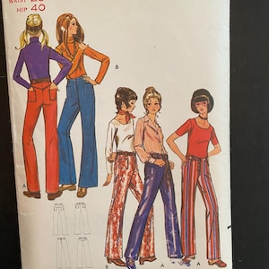 May include: Vintage sewing pattern for women's trousers. The pattern is for a pair of wide-legged trousers with a high waist. The pattern includes three different styles of trousers, each with a different print. The pattern is from Butterick and is number 5947. The pattern is for sizes 22 to 29, with hip measurements from 32 1/2 to 40 inches.