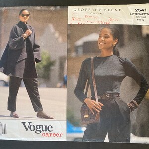 May include: A sewing pattern for a black top and a black coat. The pattern is from Vogue Patterns and is designed by Geoffrey Beene. The pattern number is 2541 and the size is 6-8-10.