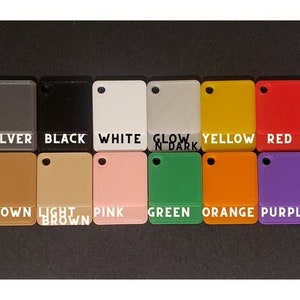 May include: A color chart showing 16 different colors of plastic. The colors are: gold, silver, black, white, glow in dark, yellow, red, light blue, dark brown, brown, light brown, pink, green, orange, purple, and dark blue.