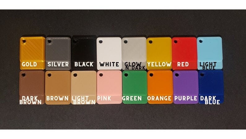 May include: A color chart showing 16 different colors of plastic. The colors are: gold, silver, black, white, glow in dark, yellow, red, light blue, dark brown, brown, light brown, pink, green, orange, purple, and dark blue.