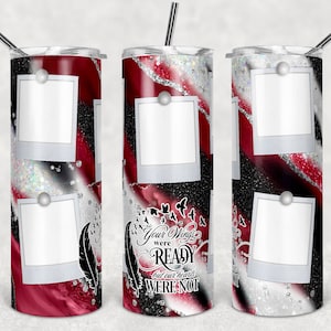 May include: A stainless steel tumbler with a red, black, and white design. The tumbler has four photo frames with white borders and a quote that reads "Your wings were ready but our hearts were not".