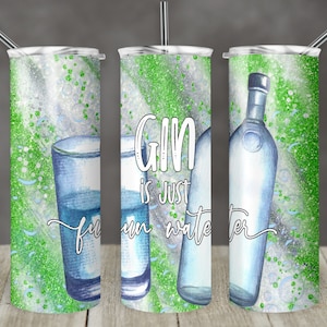 May include: Three stainless steel tumblers with a green and white glitter background. The centre tumbler has the text "Gin is just fun water" in white. The left tumbler has a glass of water and the right tumbler has a bottle of gin.