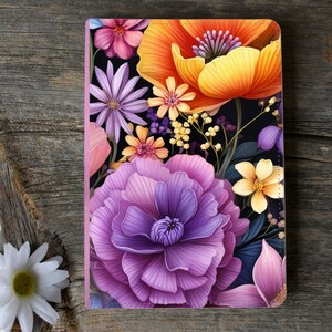 May include: A floral design with a purple flower in the foreground, a yellow flower, and a red and yellow flower in the background. The flowers are on a black background.