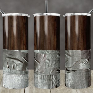 May include: Three stainless steel tumblers with a wood grain design and a layer of gray duct tape around the bottom of each tumbler.