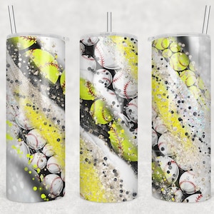 May include: Three clear, stainless steel tumblers with lids and straws. Each tumbler features a design of yellow and white softball graphics with black and silver glitter accents.