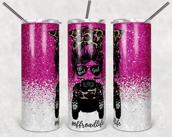 May include: A pink and white glitter tumbler with a graphic of a woman with a leopard print bandana, sunglasses, and an off-road vehicle. The text "Off Road Girl" and "#offroadlife" are on the tumbler.