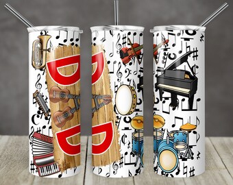 Puede incluir: Tres vasos blancos con un tema musical. Los vasos presentan una variedad de instrumentos musicales, incluyendo un piano, una batería, un violín, una guitarra, una trompeta y un acordeón. Los vasos están decorados con notas musicales y la palabra "DAD".