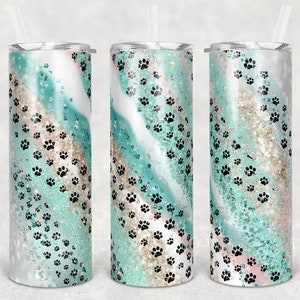 May include: Three stainless steel tumblers with a teal, white and gold glitter swirl design and black paw prints.